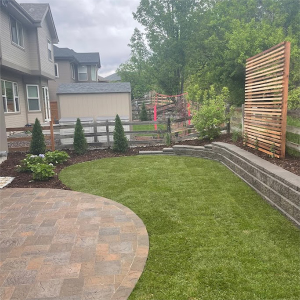 Custom Highlands Ranch backyard landscape renovation with paver patio